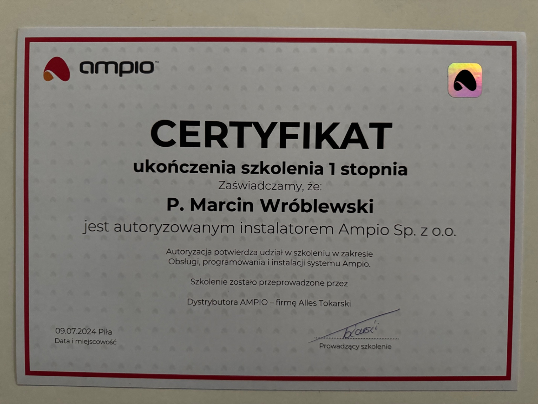 Certyfikat ukończenia szkolenia pierwszego stopnia firmy Ampio, potwierdzający autoryzację dla instalatora P. Marcina Wróblewskiego w zakresie obsługi, programowania i instalacji systemu Ampio.