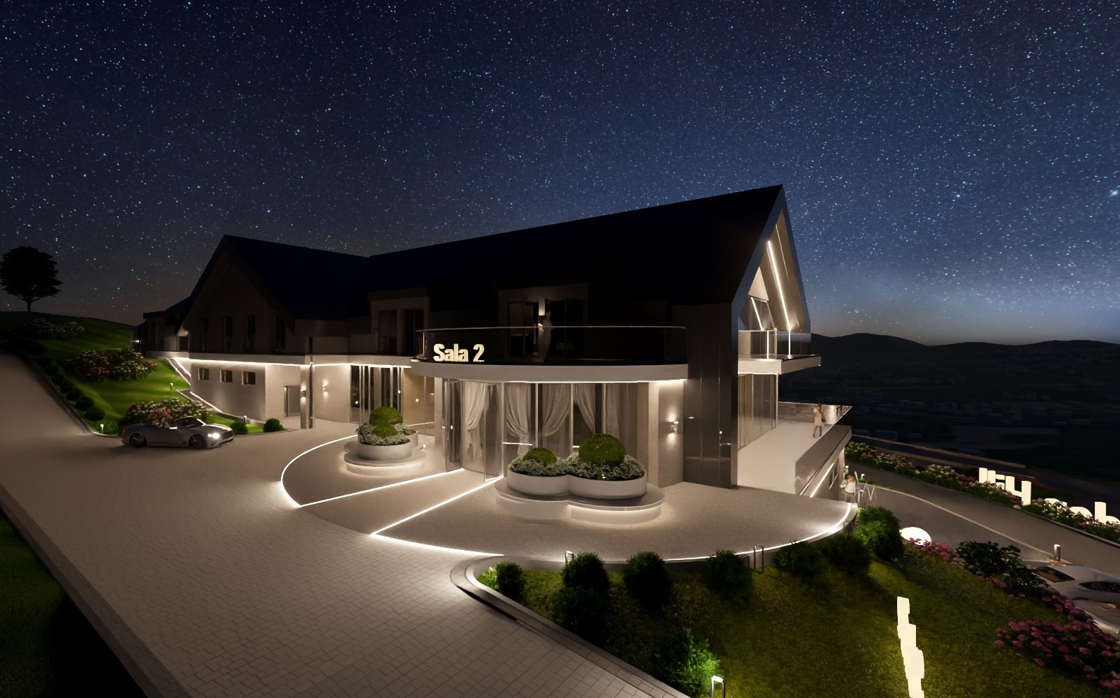 Nowoczesny budynek z napisem 'Sala 2' oświetlony nocą, widok z zewnątrz. Projekt elewacji z elementami zieleni i oświetleniem podkreślającym architekturę.