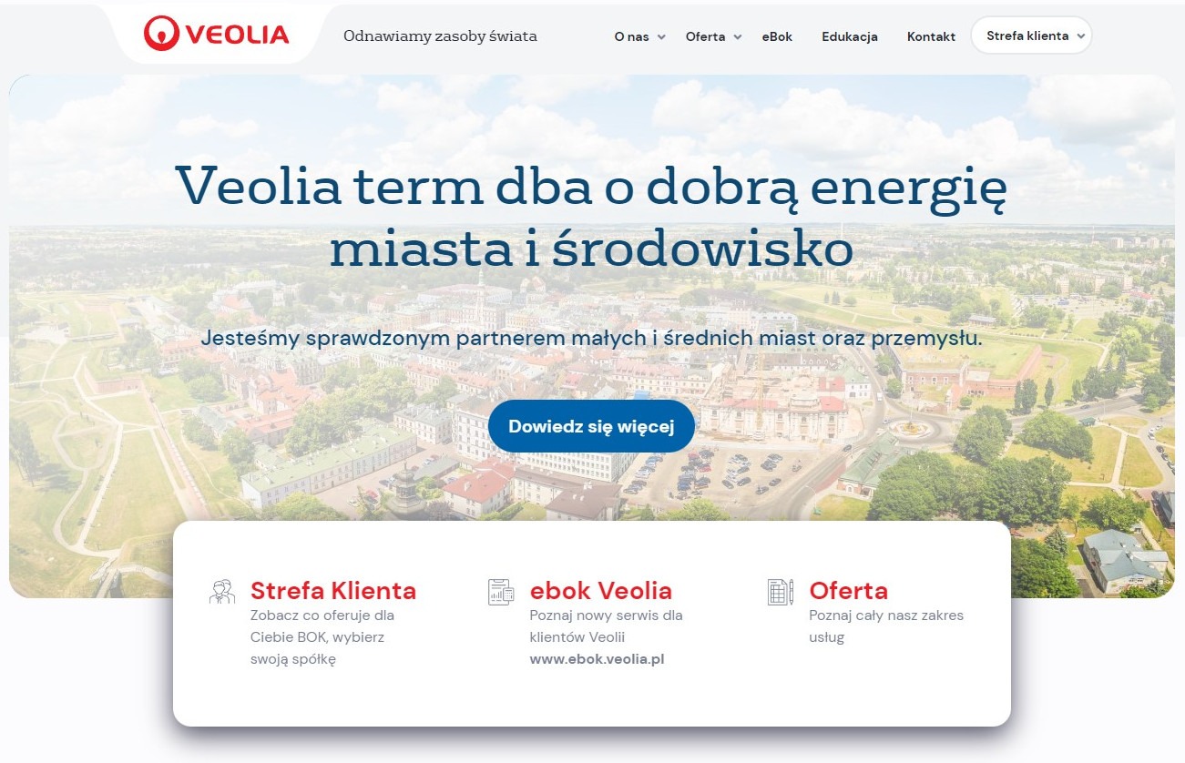 Strona internetowa firmy Veolia z nagłówkiem 'Veolia term dba o dobrą energię miasta i środowisko' na tle panoramy miasta.