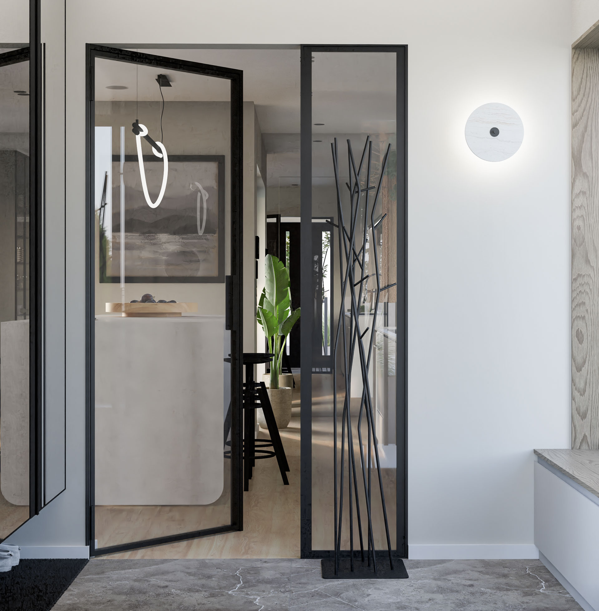 Nowoczesne wejście do mieszkania z czarnymi, przeszklonymi drzwiami, minimalistycznym wieszakiem na ubrania w kształcie gałęzi i okrągłą lampą ścienną.