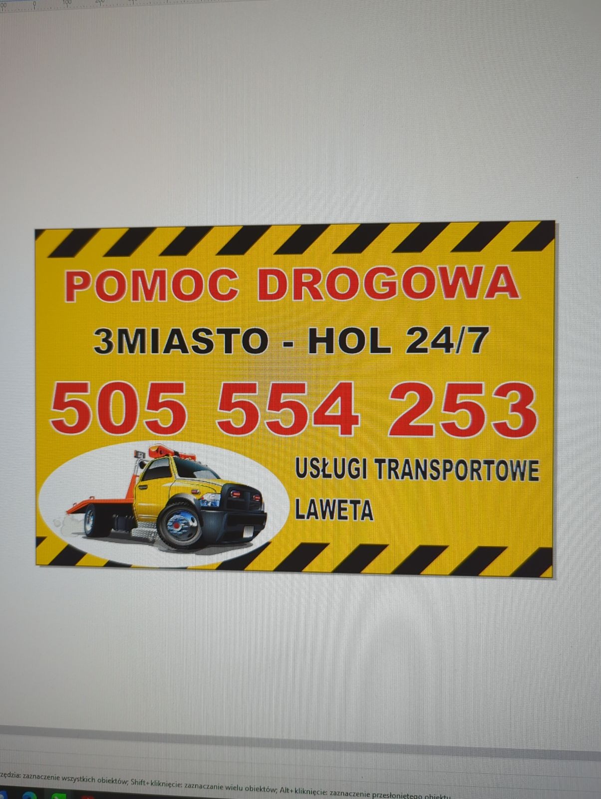 Żółto-czarny baner reklamowy z napisem 'Pomoc Drogowa 3Miasto - Hol 24/7', numerem telefonu 505 554 253, 'Usługi transportowe' i nazwą 'Laweta', obok grafika przedstawiająca lawetę.