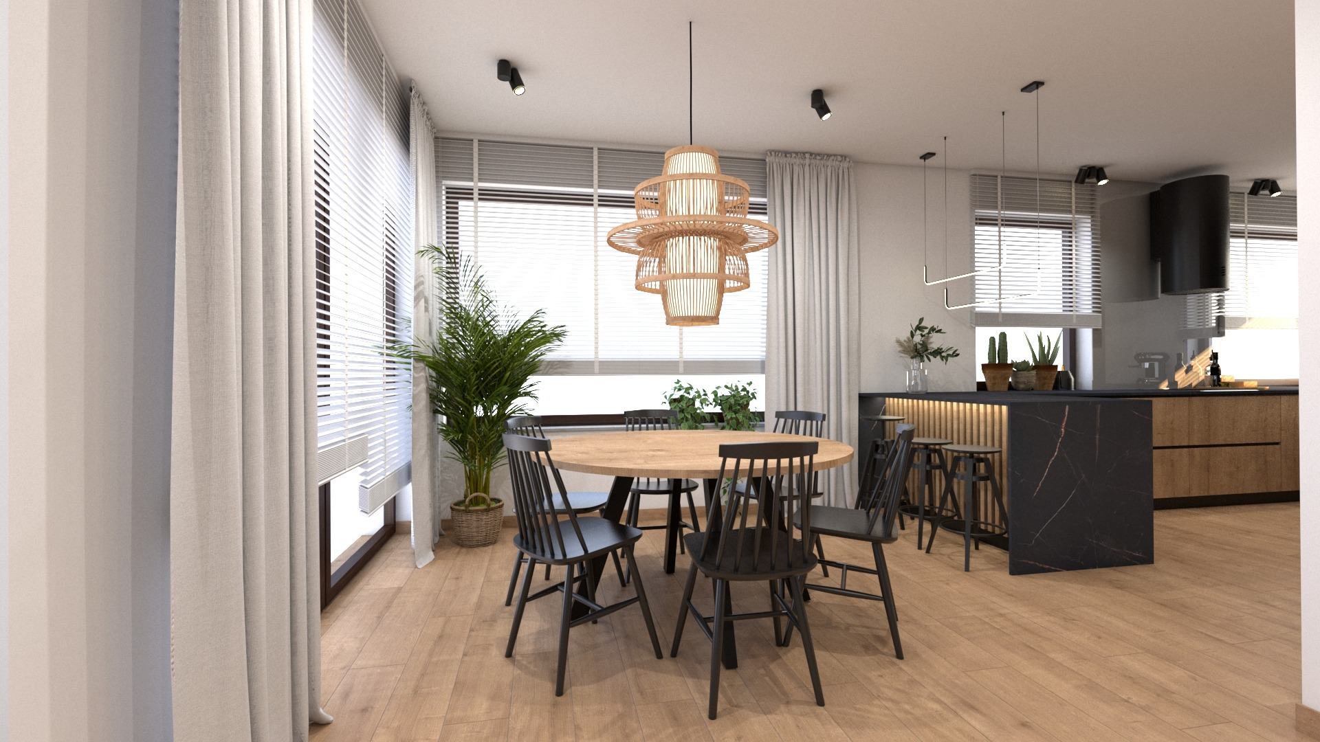 Jasne, nowoczesne wnętrze z okrągłym drewnianym stołem otoczonym czarnymi krzesłami, nad którym wisi dekoracyjna lampa z naturalnych materiałów. W tle widoczna kuchnia z czarnym marmurowym blatem...