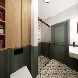 Sopata Studio Design Katarzyna Sopata - Nowoczesna łazienka z drewnianą szafką, zielonymi płytkami i wzorzystą podłogą. Kabina prysznicowa z brązowymi ramami. Umywalka z minimalistyczną armaturą.