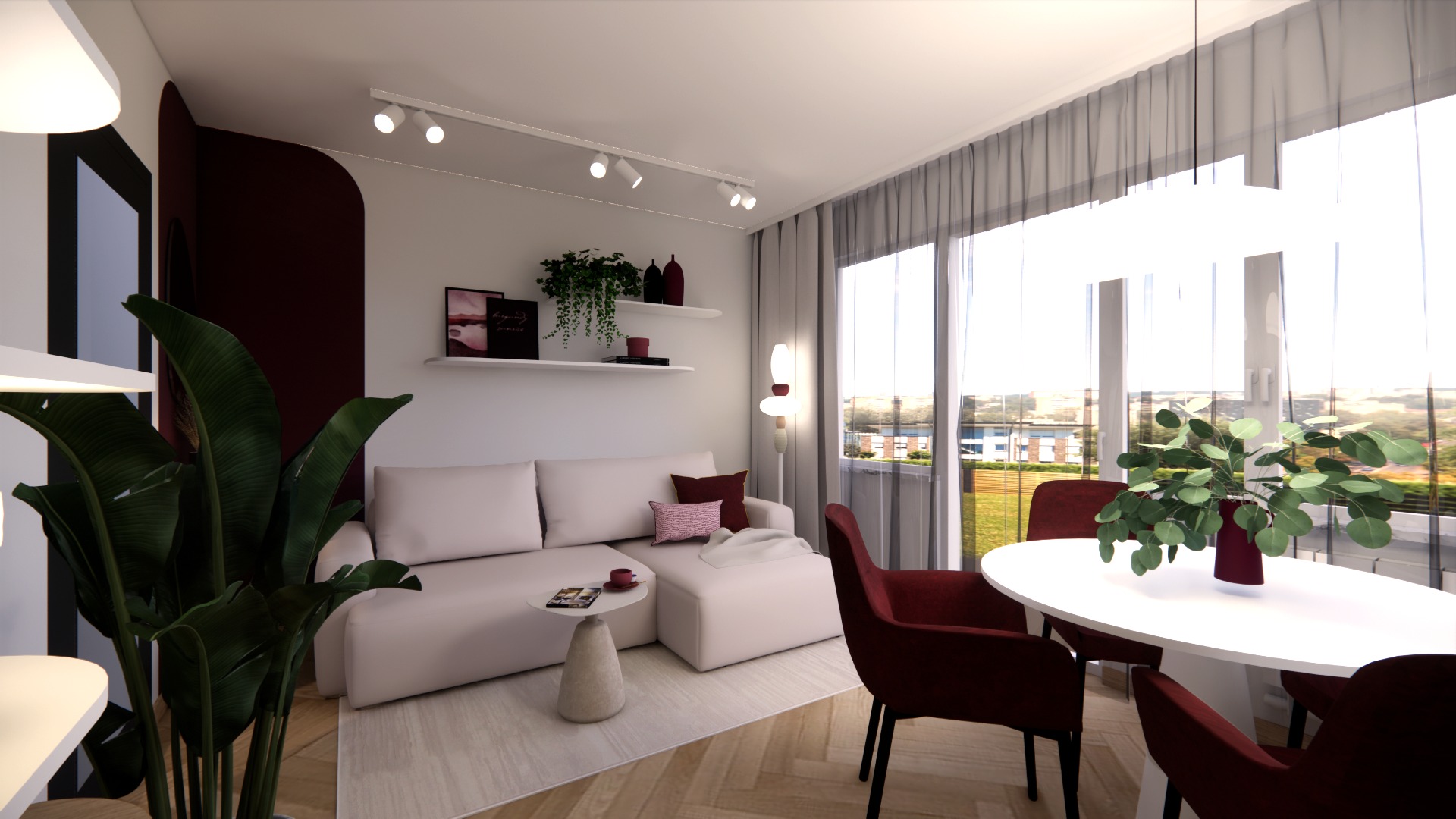 Jasne wnętrze z sofą, okrągłym stołem i dużym oknem z widokiem na zewnątrz. Minimalistyczny design z akcentami roślinnymi i burgundowymi krzesłami.