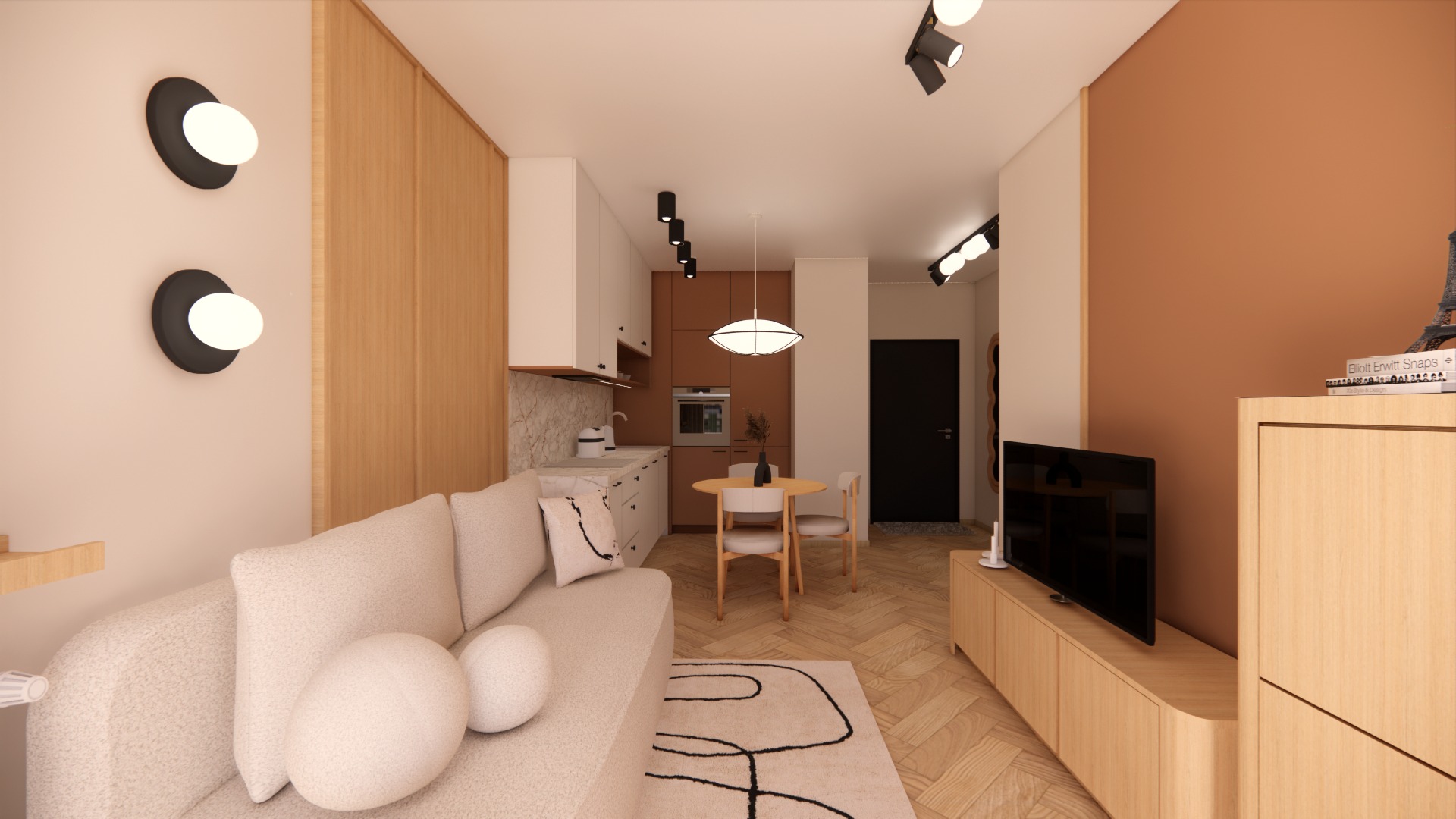 Wnętrze mieszkania w ciepłych barwach: beżowa sofa z poduszkami, drewniana zabudowa kuchenna, okrągły stół z krzesłami, telewizor na szafce RTV i dekoracyjne oświetlenie.