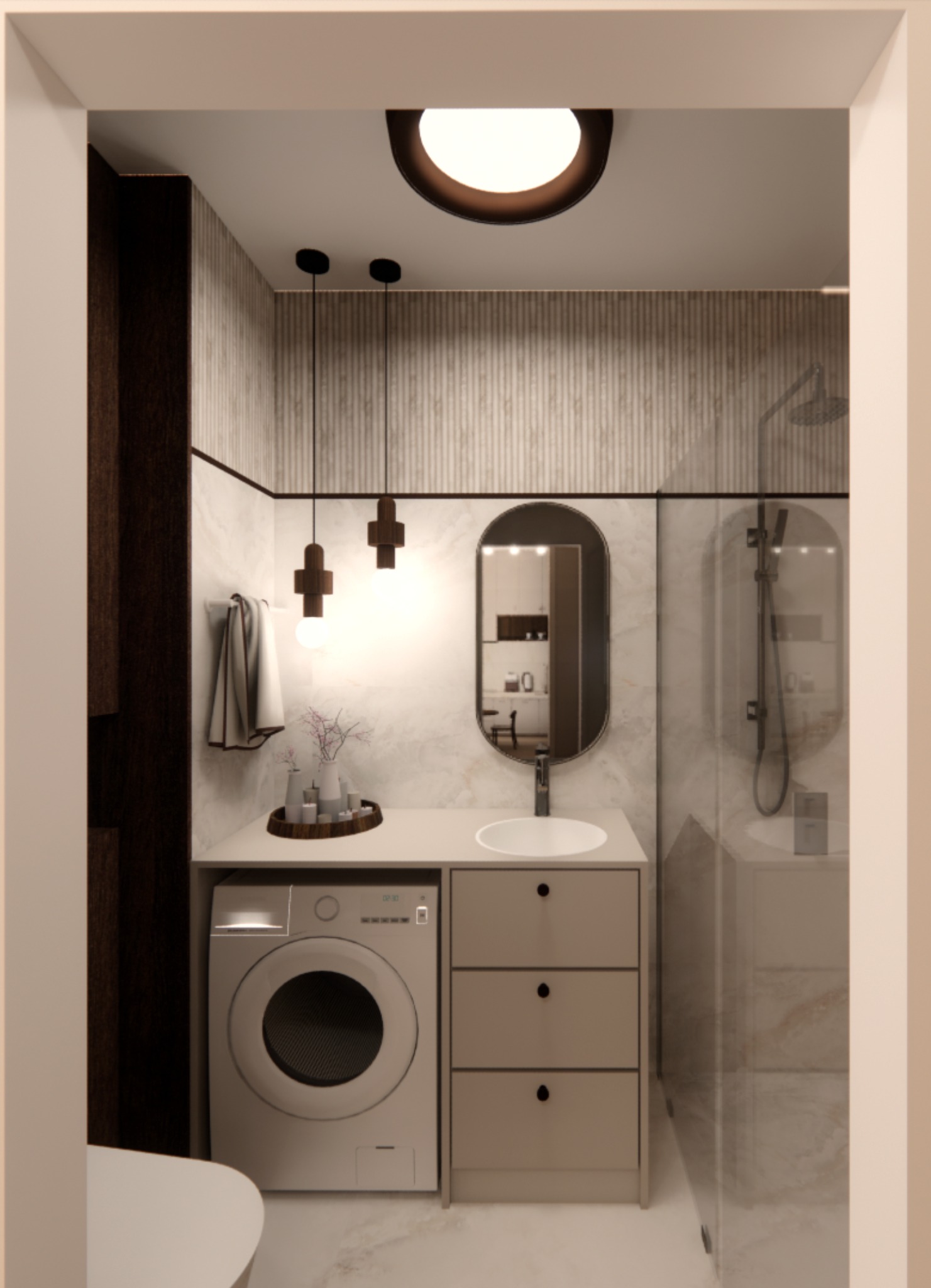Nowoczesna łazienka z pralką pod blatem, owalnym lustrem i kabiną prysznicową. Minimalistyczne oświetlenie punktowe i stonowana kolorystyka tworzą spójną całość.