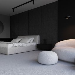 KAGIZE AND PARTNERS Dominik Kagize Ntibansiga - Minimalistyczna sypialnia w odcieniach szarości i czerni z łóżkiem na platformie, okrągłym lustrem na ścianie i puszystym fotelem typu boucle.