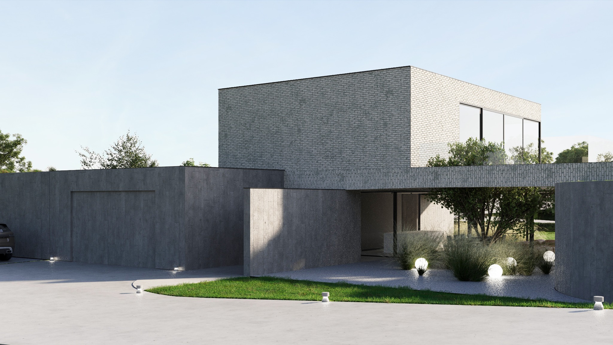 Nowoczesny dom z szarej cegły z płaskim dachem, betonowym ogrodzeniem i podjazdem oświetlonym kulistymi lampami.