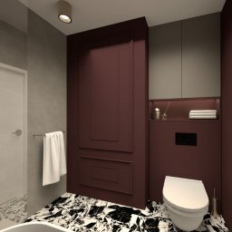 Molki Sp. z o.o. - Elegancka łazienka z marmurową posadzką, bordowymi ścianami z dekoracyjnymi panelami i wiszącą szafką. Nowoczesny design z subtelnym oświetleniem.