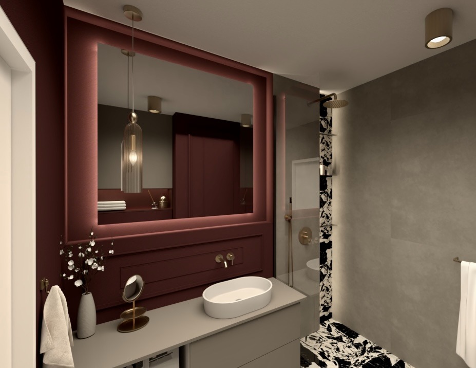 Nowoczesna łazienka z dużym, podświetlanym lustrem w bordowej ramie, umywalką nablatową i kabiną prysznicową z marmurowym akcentem. Stylowe oświetlenie.