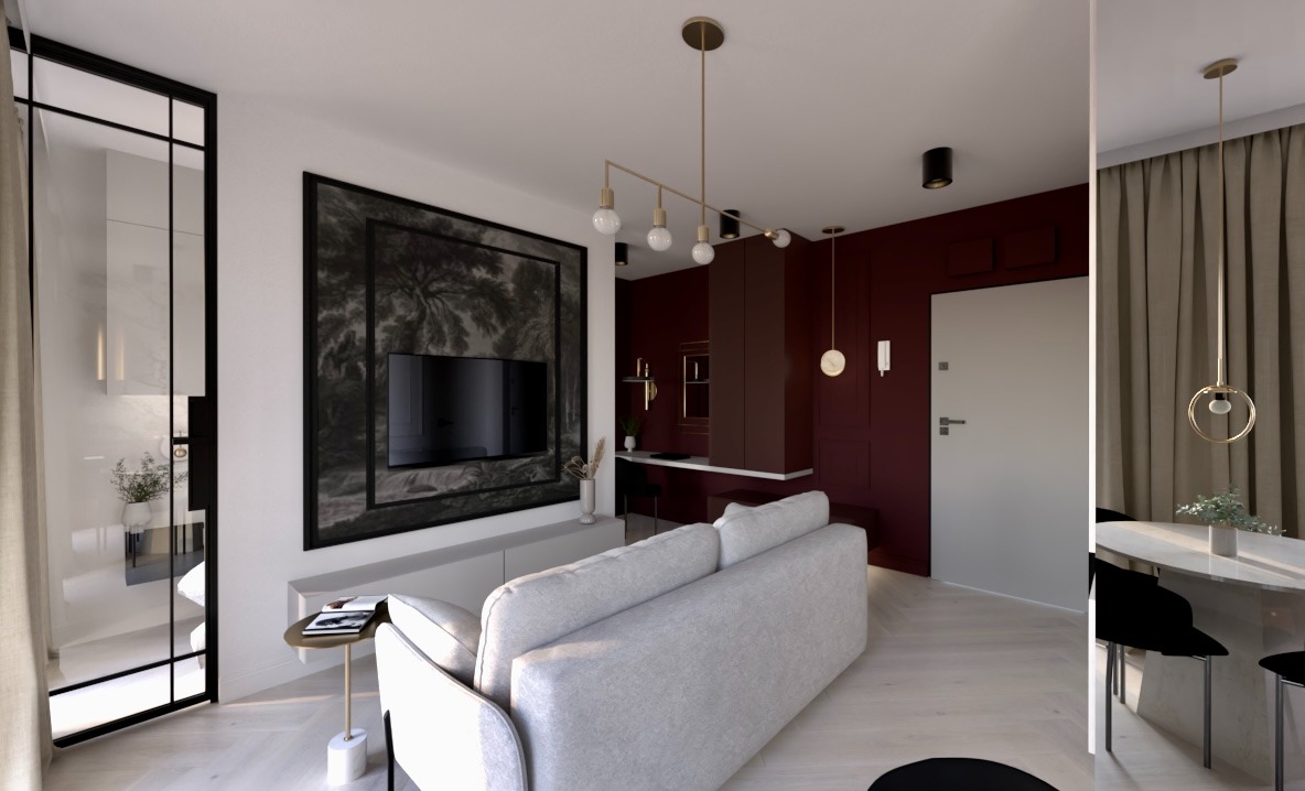 Nowoczesny salon z sofą na pierwszym planie, telewizorem w ozdobnej ramie i designerskim oświetleniem, ukazujący aranżację wnętrza w stonowanej kolorystyce.