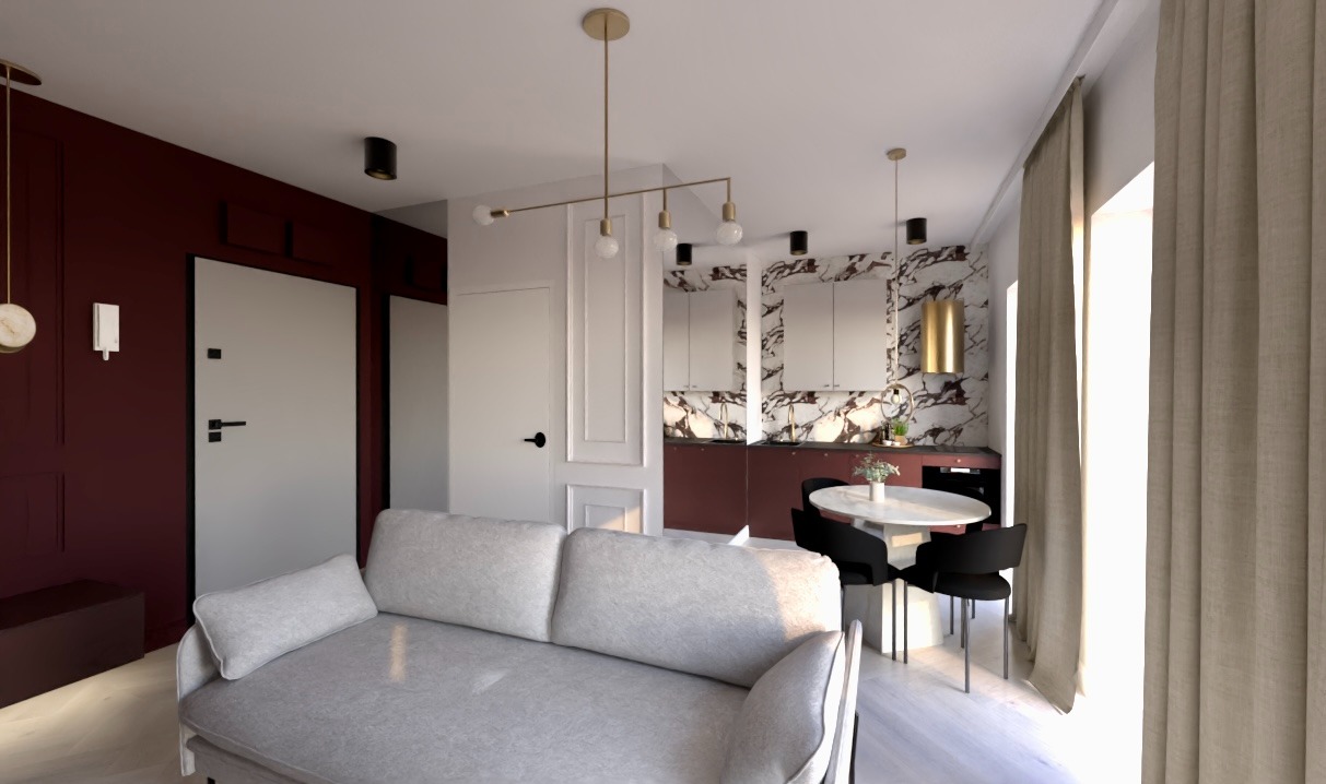 Nowoczesne wnętrze: szara sofa, okrągły stół z czarnymi krzesłami, marmurowa ściana w kuchni, złote lampy i bordowe akcenty. Całość w jasnej tonacji.