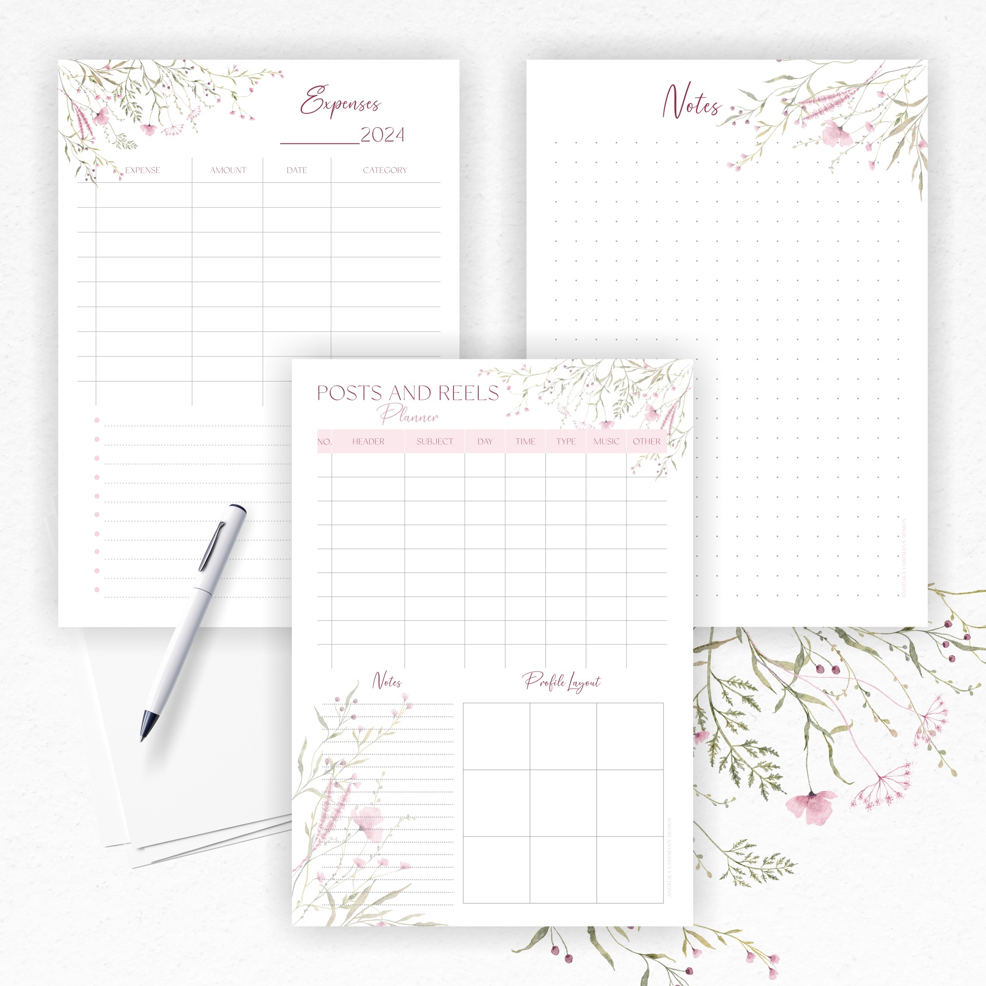 Zestaw planerów z motywem akwarelowych kwiatów, obejmujący planer wydatków, notatnik w kropki oraz planer postów i reels, leżący obok białego długopisu.