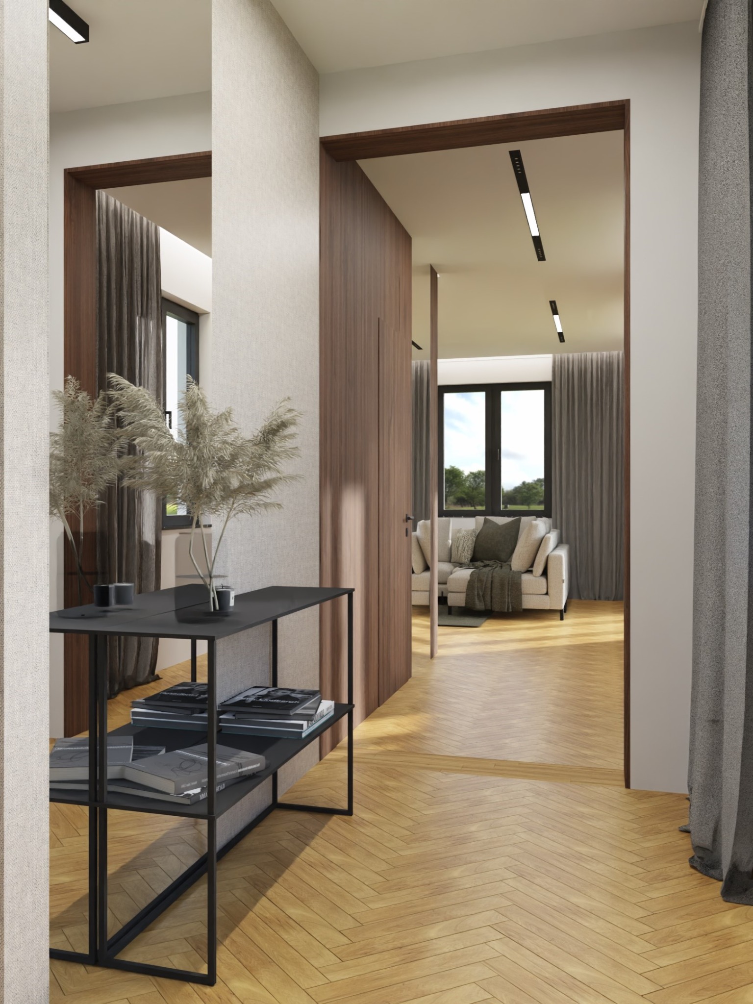 Wnętrze mieszkania: korytarz z parkietem w jodełkę, czarna konsola z książkami i dekoracyjnymi trawami, widok na salon z beżową sofą i szarymi zasłonami, minimalistyczne oświetlenie.