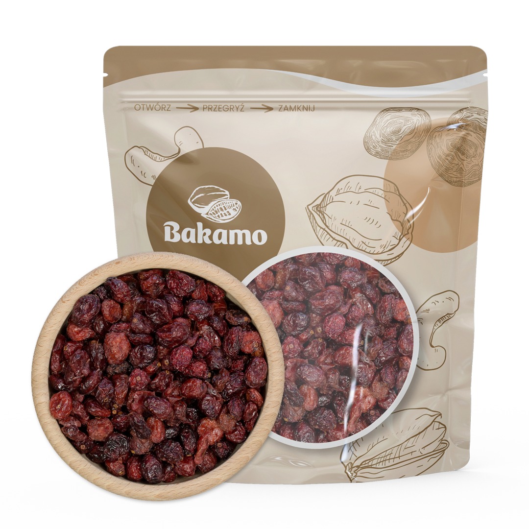 Suszona żurawina w drewnianej miseczce, obok torebka z logo Bakamo i grafikami orzechów, z okienkiem prezentującym produkt.