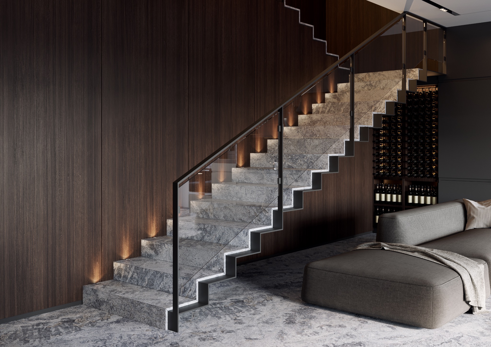 Nowoczesne schody z kamienia z podświetleniem LED, szklaną balustradą i ciemnym drewnem na ścianie, obok regał na wino i szara sofa.