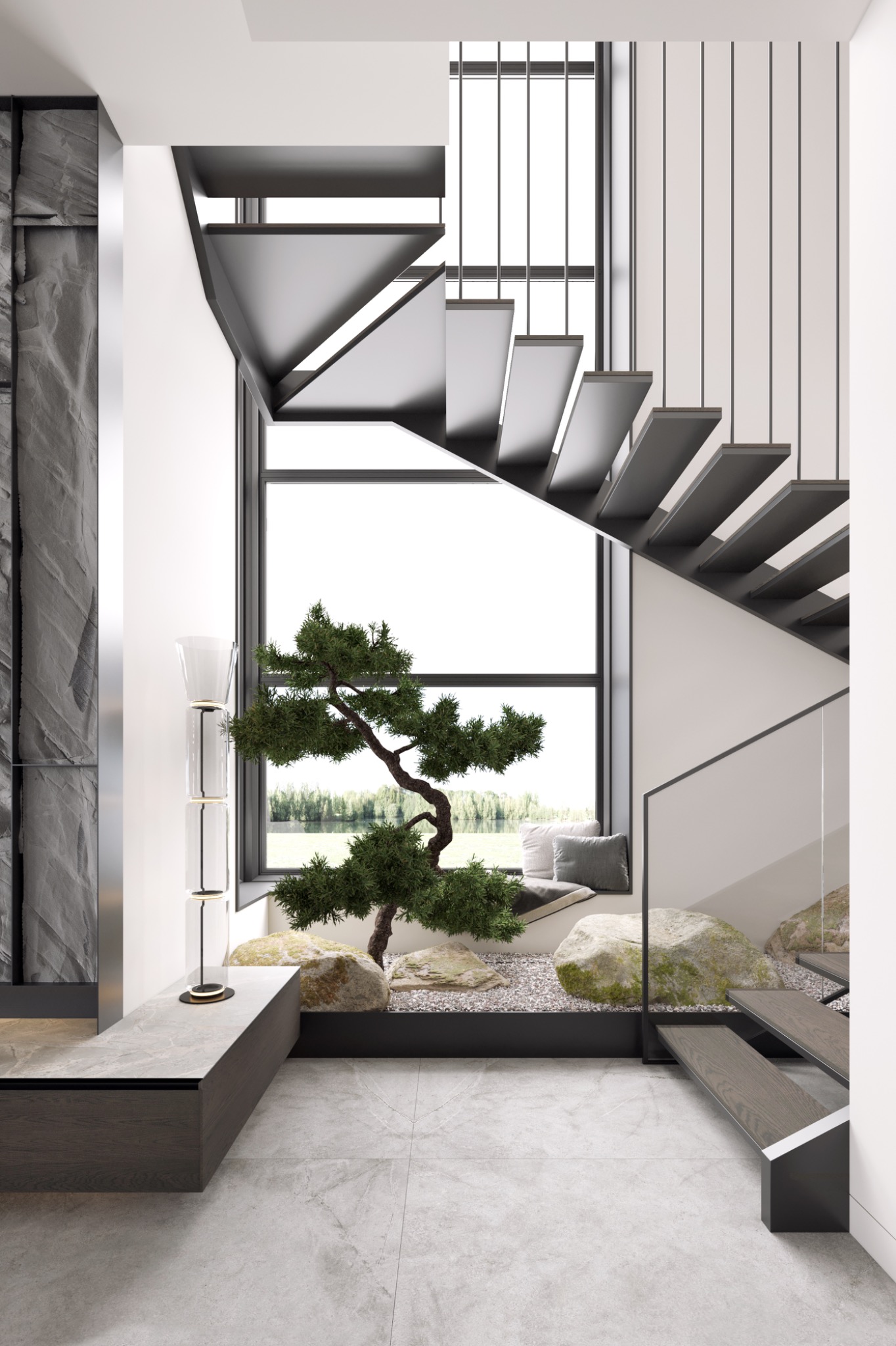 Nowoczesne schody wspornikowe z metalowymi balustradami, okno z widokiem na zieleń, dekoracyjny skalniak z bonsai i kamieniami w holu.