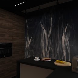 G Art design studio Aleksandra Gumoś - Nowoczesna kuchnia z drewnianymi szafkami, piekarnikiem Electrolux, czarnym blatem i abstrakcyjną tapetą w odcieniach szarości. Na blacie toster i śniadanie.