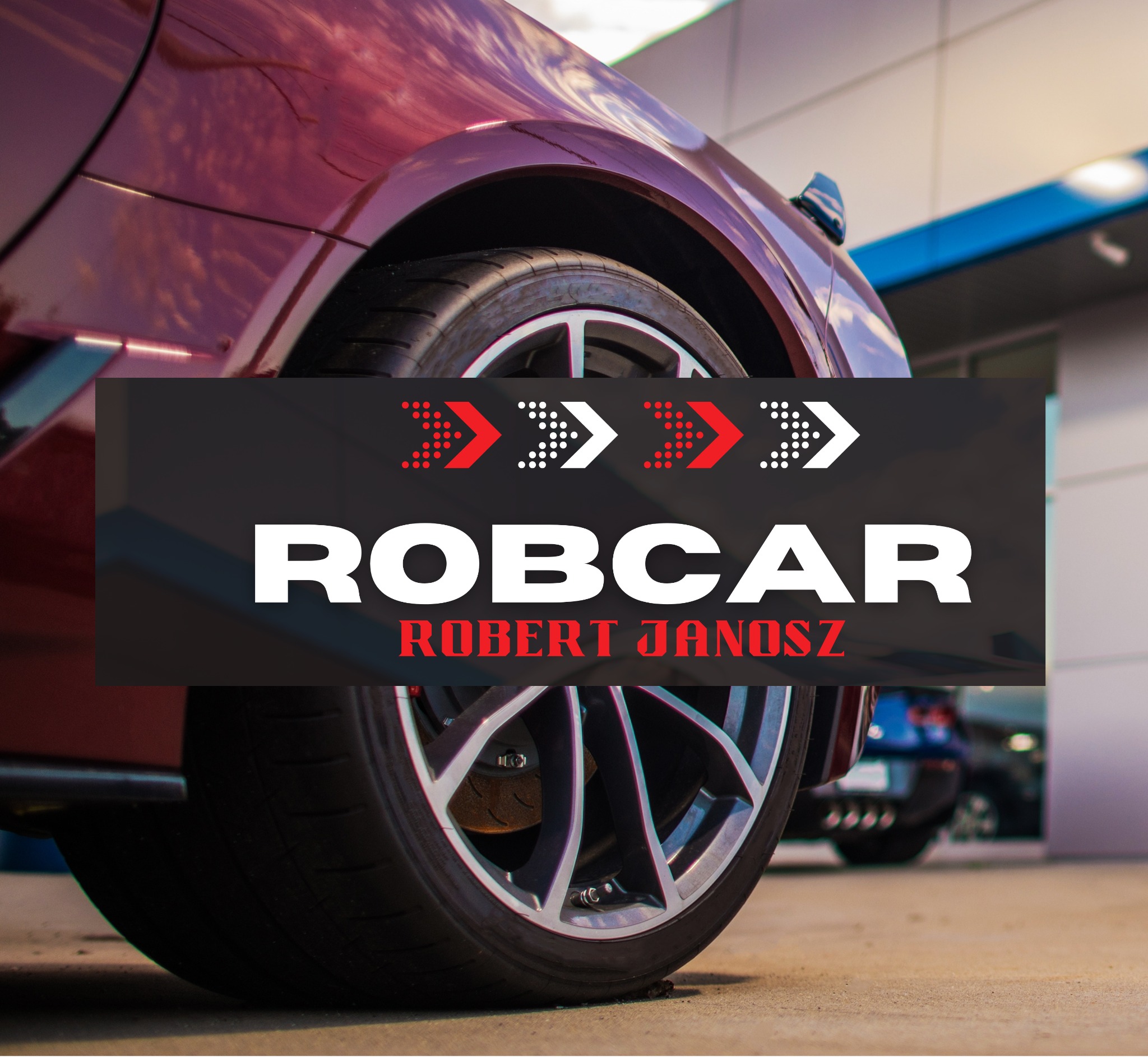 Częściowe ujęcie tyłu bordowego samochodu z widocznym kołem i logotypem 'ROBCAR ROBERT JANOSZ' nałożonym na zdjęcie.