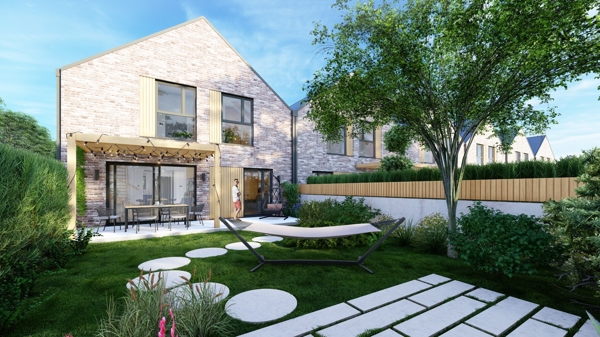 Wizualizacja domu z cegły z ogrodem, pergola z oświetleniem nad tarasem, hamak na trawniku, ścieżka z płyt, drewniane panele na elewacji, osoba w tle.
