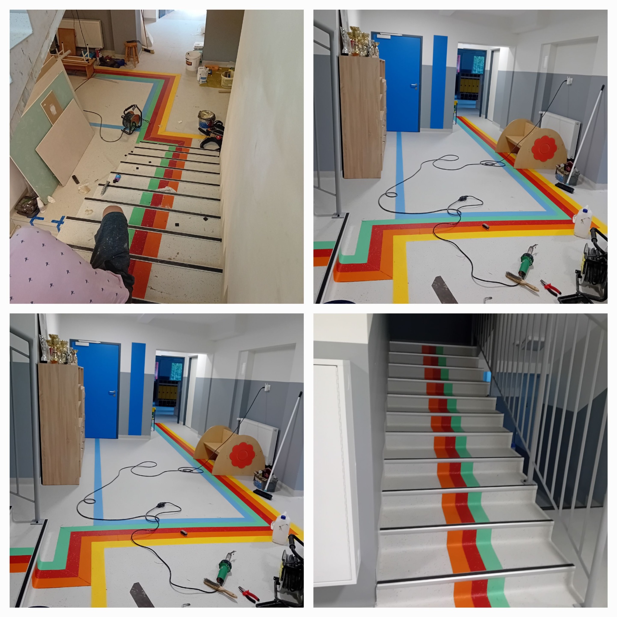 Wnętrze korytarza i schodów z nową, kolorową posadzką z pasami w kolorach tęczy, widoczne narzędzia pracy i materiały budowlane, fragment pracownika w kadrze.