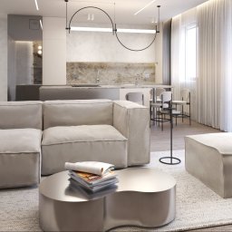 Adelina Interiors - Jasne wnętrze w neutralnych barwach: sofa modułowa, metalowy stolik z magazynami, wyspa kuchenna z hokerami, okno z białymi zasłonami. Minimalistyczne lampy.