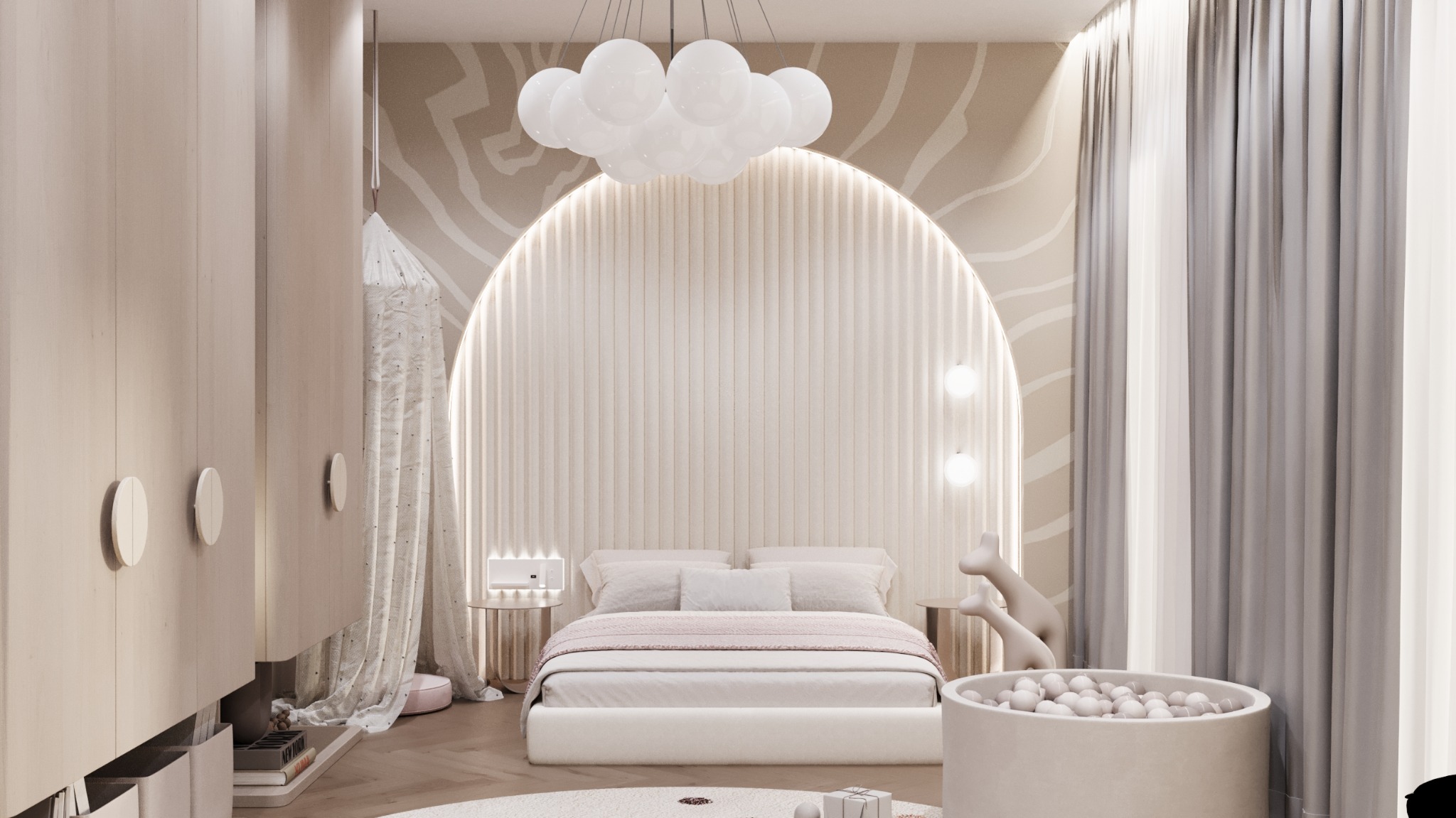 Jasny pokój dziecięcy z łóżkiem podświetlonym łukiem, lampą w kształcie chmury, kulkami do zabawy i baldachimem przy szafie.