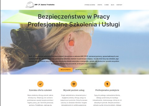 Responsywna strona internetowa firmy BHP z blondynką w kasku i zatyczkami do uszu na pierwszym planie, oferująca profesjonalne szkolenia i usługi z zakresu bezpieczeństwa w pracy.