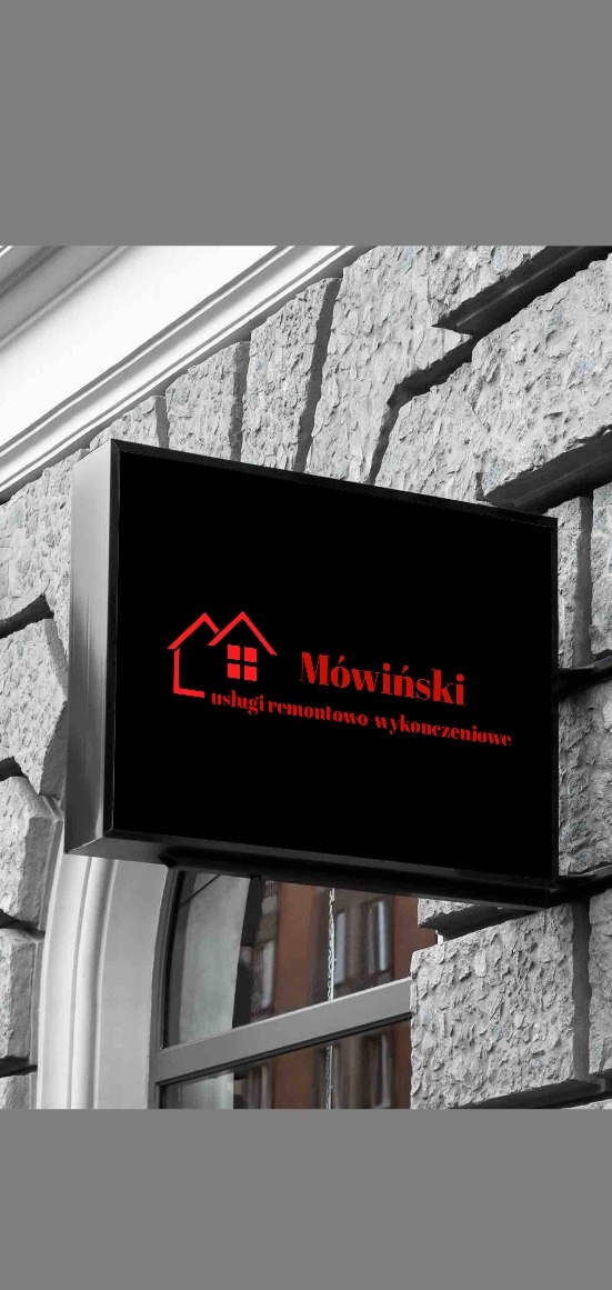 Szyld firmy remontowo-wykończeniowej Mówiński z logo w kształcie domu, zamontowany na kamiennej fasadzie budynku nad wejściem.