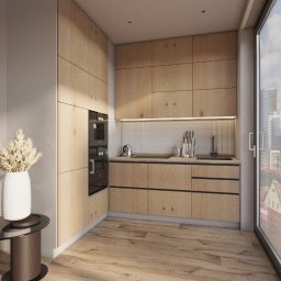 INCGI LTD - Jasna, minimalistyczna kuchnia z drewnianymi frontami szafek, czarnym piekarnikiem w zabudowie i widokiem na miasto przez duże okno. Na pierwszym planie dekoracyjny wazon z suszonymi kwiatami...