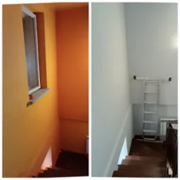 Klatka schodowa po remoncie: po lewej stronie pomarańczowa ściana z oknem zabezpieczonym taśmą malarską, po prawej stronie ściana pomalowana na biało z rozstawioną drabiną aluminiową.