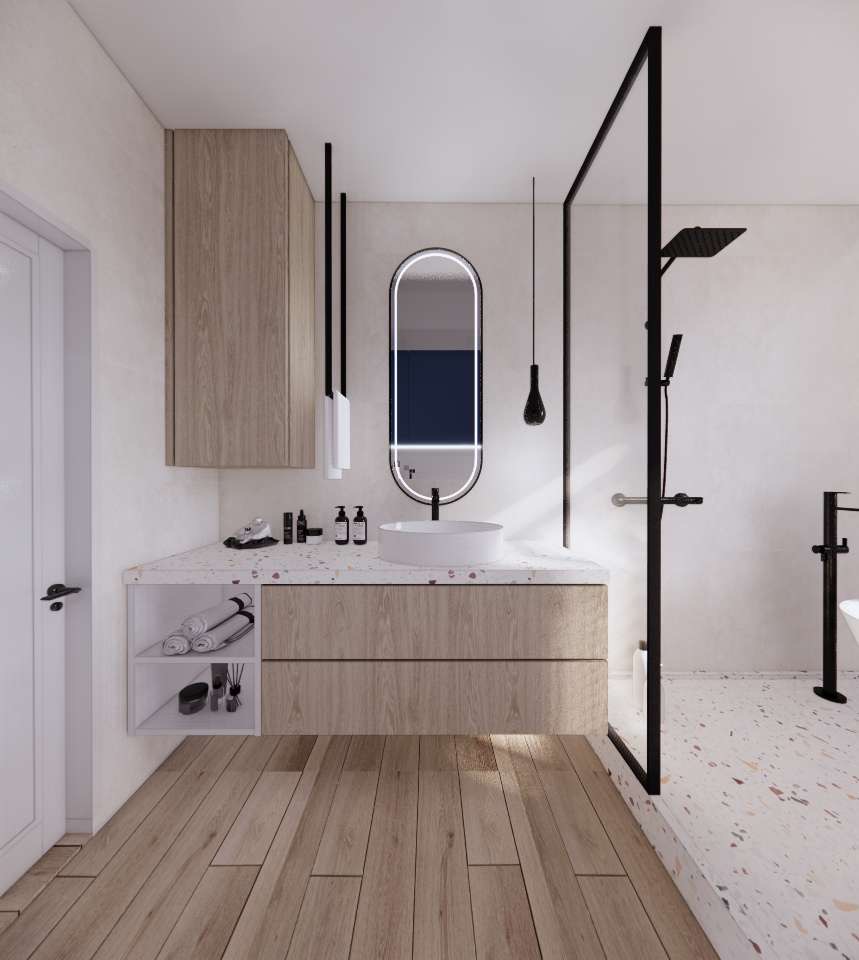 Nowoczesna łazienka z drewnianą podłogą i szafką pod umywalką, owalne lustro z podświetleniem LED, czarna kabina prysznicowa i biała wanna w tle.