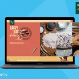 Strona internetowa na ekranie laptopa MacBook Pro prezentująca pieczywo, składniki i logo firmy 'Łączy nas coś dobrego', z sekcjami 'Nasze pieczywo', 'Edukacja', 'O nas' i 'Dla mediów'.