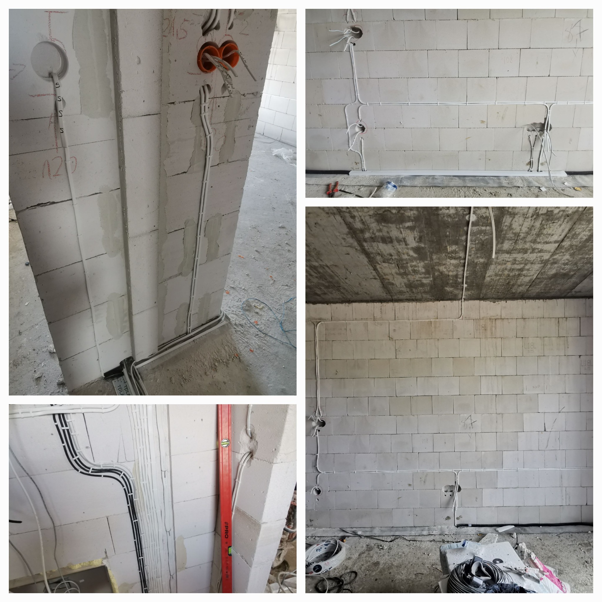 Rozprowadzone przewody elektryczne w ścianach z betonu komórkowego, widoczne puszki instalacyjne i kable w peszlach. Surowy stan, budowa w toku.