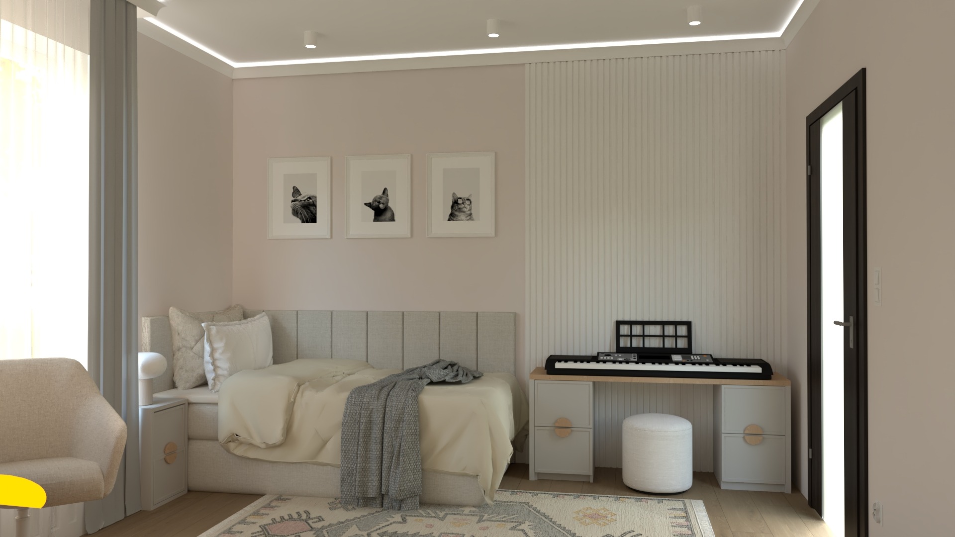 Jasna sypialnia z łóżkiem, biurkiem z keyboardem i trzema obrazkami kotów w ramkach na ścianie.