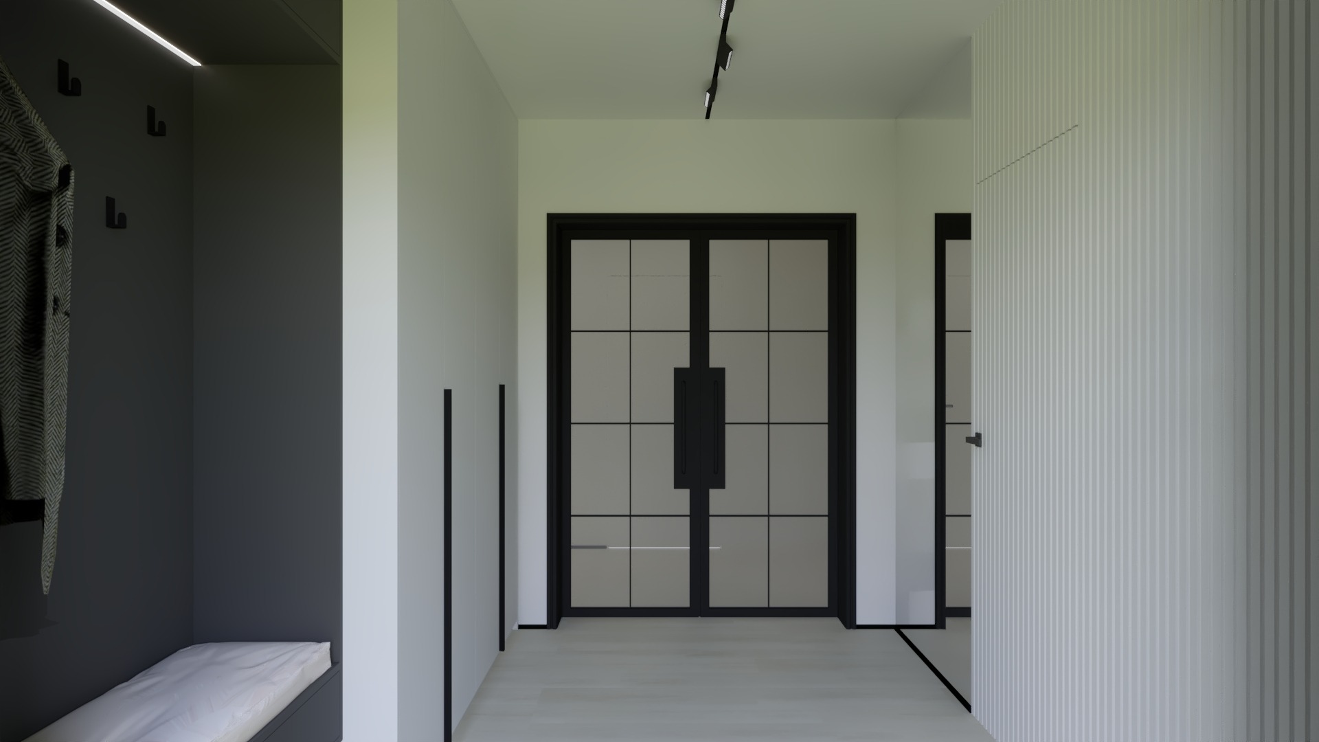 Minimalistyczny przedpokój z antracytową zabudową, wieszakami i siedziskiem, na wprost czarne, przeszklone drzwi dwuskrzydłowe, oświetlenie szynowe na suficie.