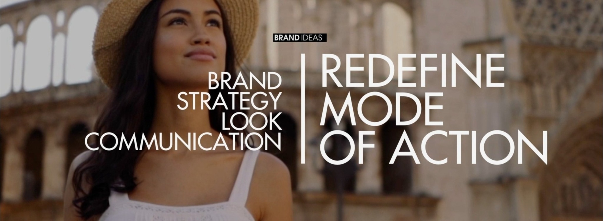 Kobieta w kapeluszu na tle architektonicznym z nałożonym tekstem: Brand Strategy Look Communication, Redefine Mode of Action oraz logo Brand Ideas.