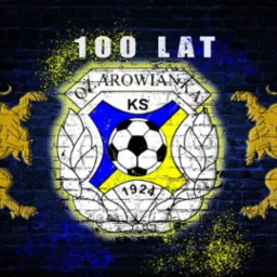 Grafika przedstawiająca logo klubu sportowego KS Klarowianka na tle ciemnej, ceglanej ściany, z dwoma złotymi lwami po bokach i napisem '100 LAT' u góry, całość w stylu graffiti.