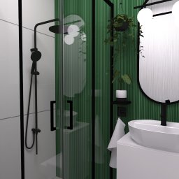 chokastudio - Nowoczesna łazienka z zielonymi ścianami, czarną armaturą i owalnym lustrem z trzema kulistymi lampami, wisząca roślina w doniczce i biała umywalka nablatowa.