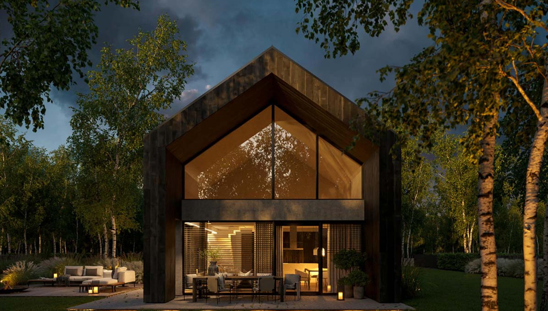 Nowoczesny dom z ciemnego drewna z dużym trójkątnym oknem na szczycie, otoczony drzewami, oświetlony ciepłym światłem wieczornym.