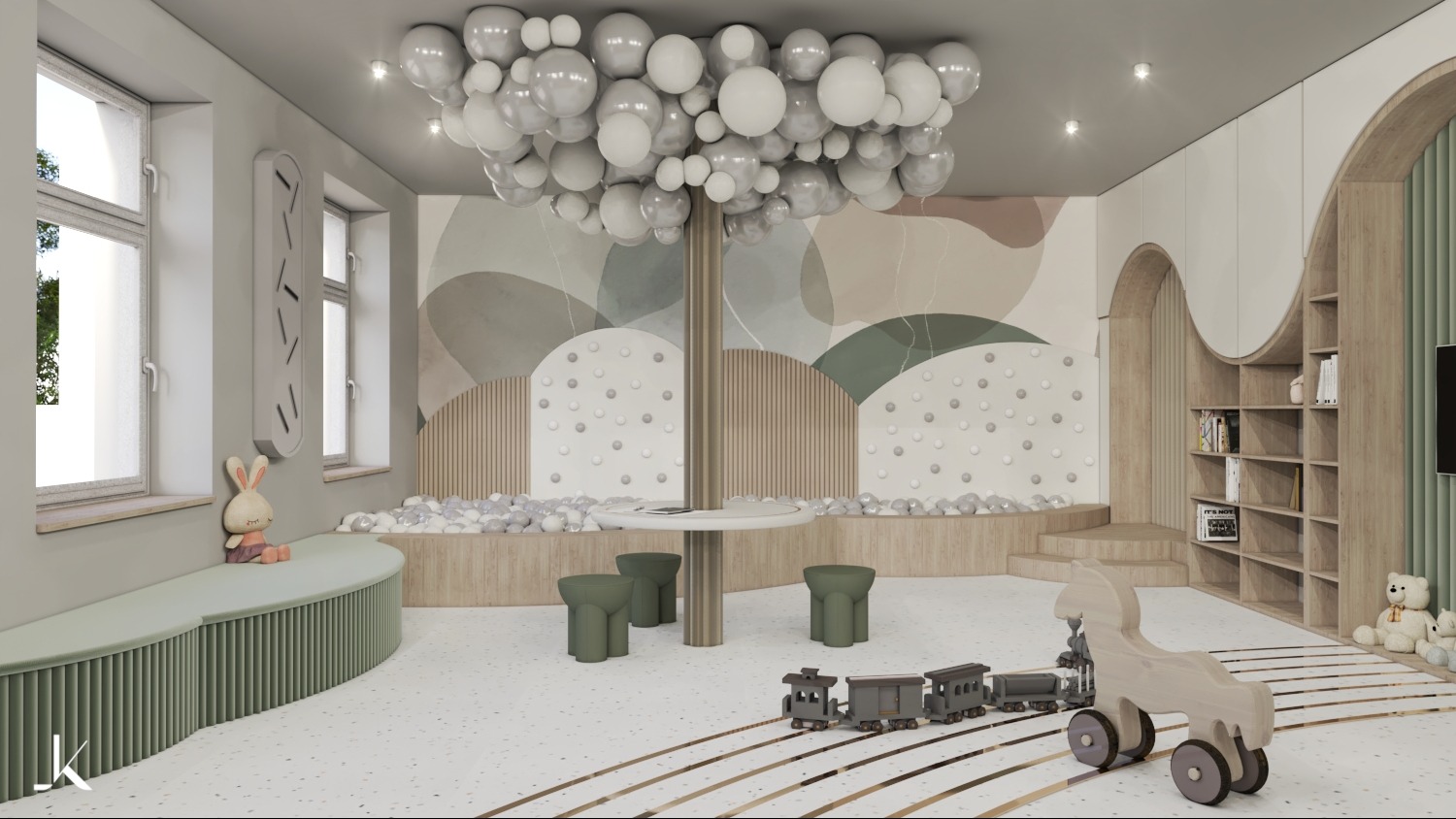 Wnętrze pokoju dziecięcego z kulkowym basenem, pastelową kolorystyką, meblami na wymiar i dekoracyjnym oświetleniem w postaci balonu.
