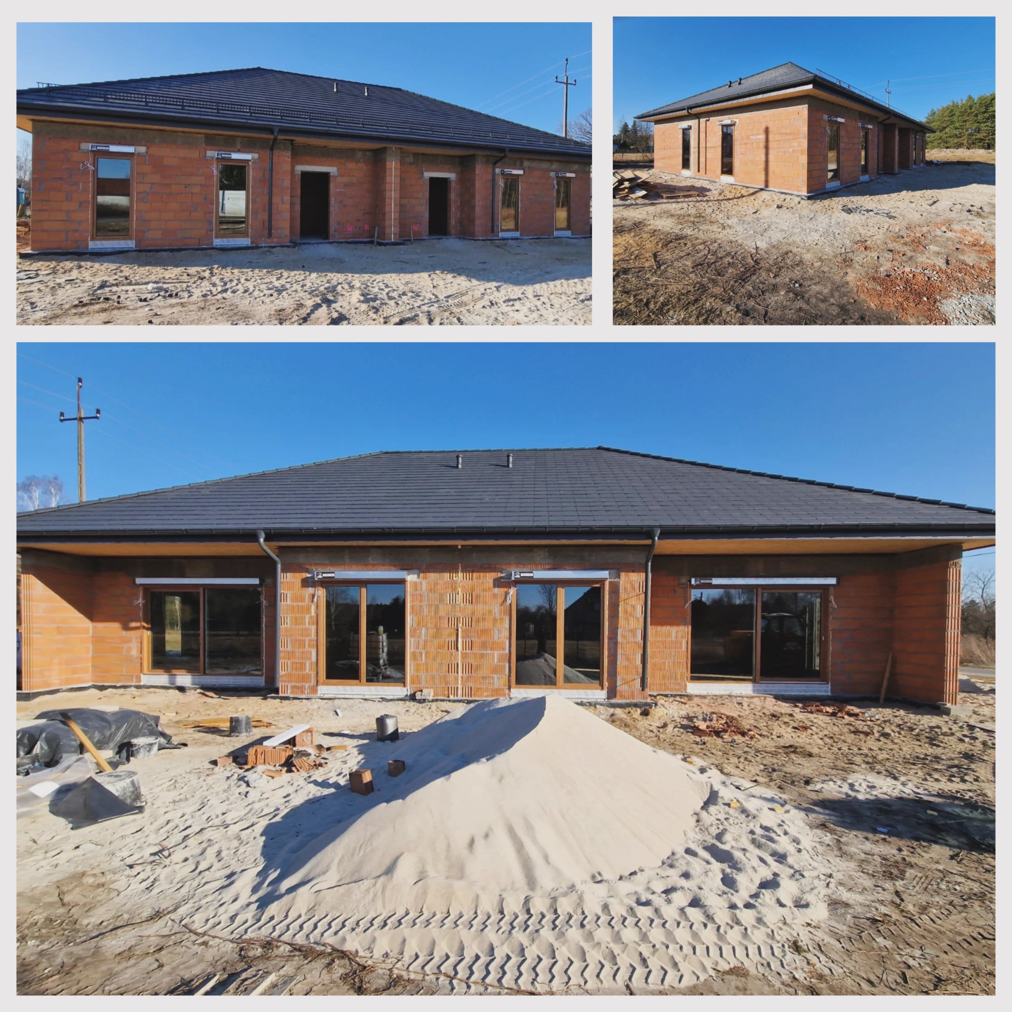 Surowy stan budynku jednorodzinnego z zamontowanymi oknami i drzwiami balkonowymi, widoczny stos piasku i materiały budowlane.