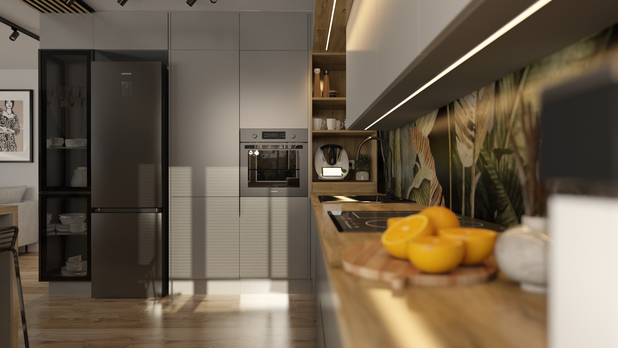 Nowoczesna kuchnia z szarymi szafkami, czarnym sprzętem AGD marki Samsung, drewnianym blatem z pomarańczami na desce do krojenia oraz tapetą w tropikalne liście.