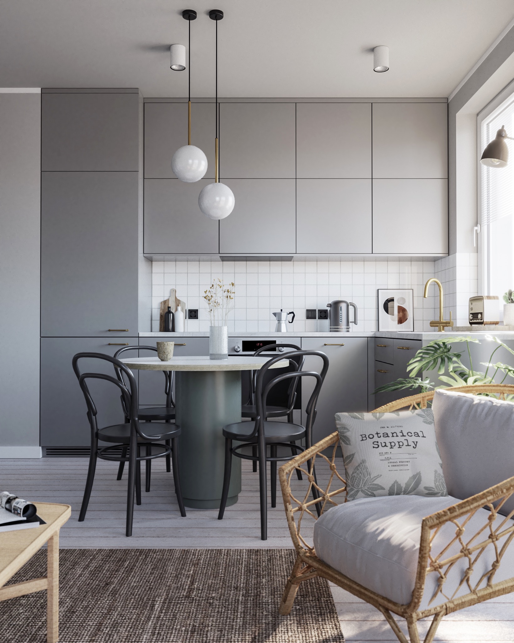 Nowoczesna kuchnia w szarościach z okrągłym stołem i krzesłami w stylu retro. Minimalistyczne oświetlenie i dekoracje roślinne dodają przytulności. W tle biała mozaika.