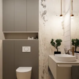 Nowoczesna łazienka z beżową szafką, umywalką nablatową, złotą armaturą, lustrem z oświetleniem punktowym i ścianą z marmurowym wzorem, uzupełniona rośliną doniczkową.