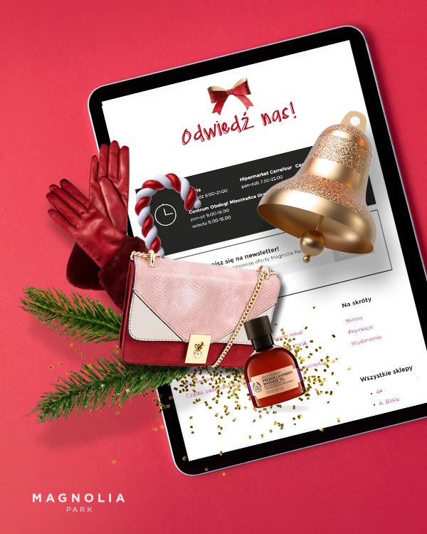 Tablet wyświetlający stronę internetową Magnolia Park z elementami świątecznymi, takimi jak bombka, laska cukrowa i czerwona kokarda, uzupełniony o torebkę, rękawiczki, butelkę olejku i konfetti...