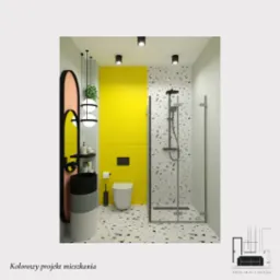 Projekt łazienki w Warszawie z żółtą ścianą, mozaikową podłogą i kabiną prysznicową ze szklanymi drzwiami, wisząca umywalka z czarno-szarym blatem i okrągłym lustrem.