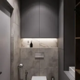 Nowoczesna toaleta podwieszana w szarej łazience z płytkami imitującymi beton, oświetleniem LED pod szafką i marmurowym akcentem nad spłuczką.