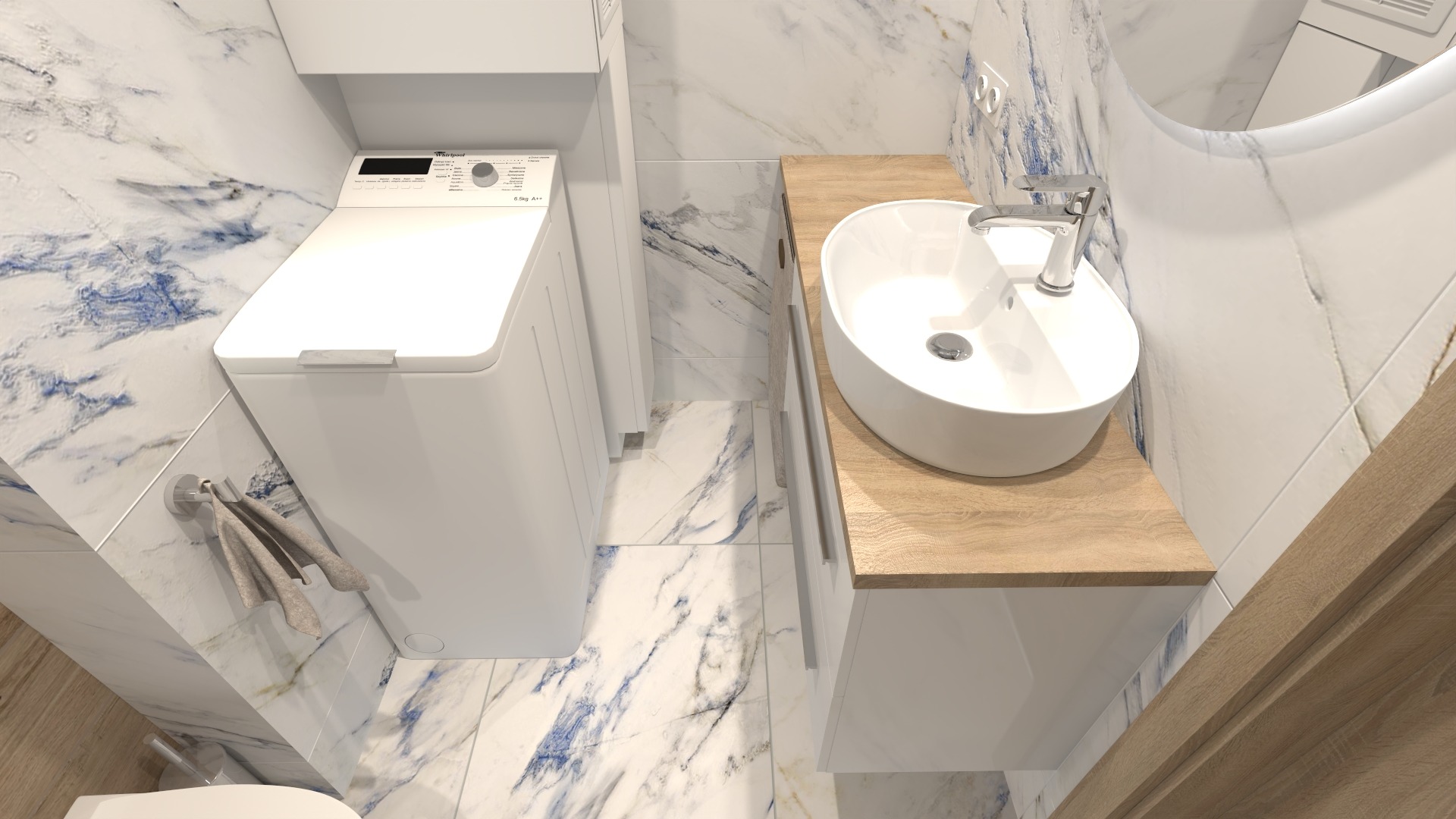 Biała, okrągła umywalka nablatowa z chromowaną baterią na blacie z jasnego drewna, obok pralka w nowoczesnej łazience z marmurowymi płytkami w odcieniach bieli i błękitu.