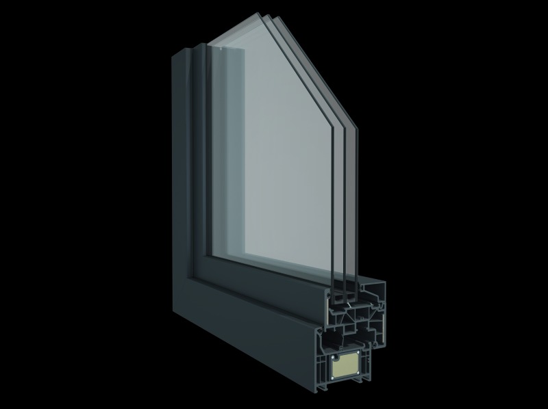 Przekrój narożny okna z potrójnym szkleniem i profilem z tworzywa sztucznego w odcieniach szarości, ukazujący jego wewnętrzną strukturę i komory.